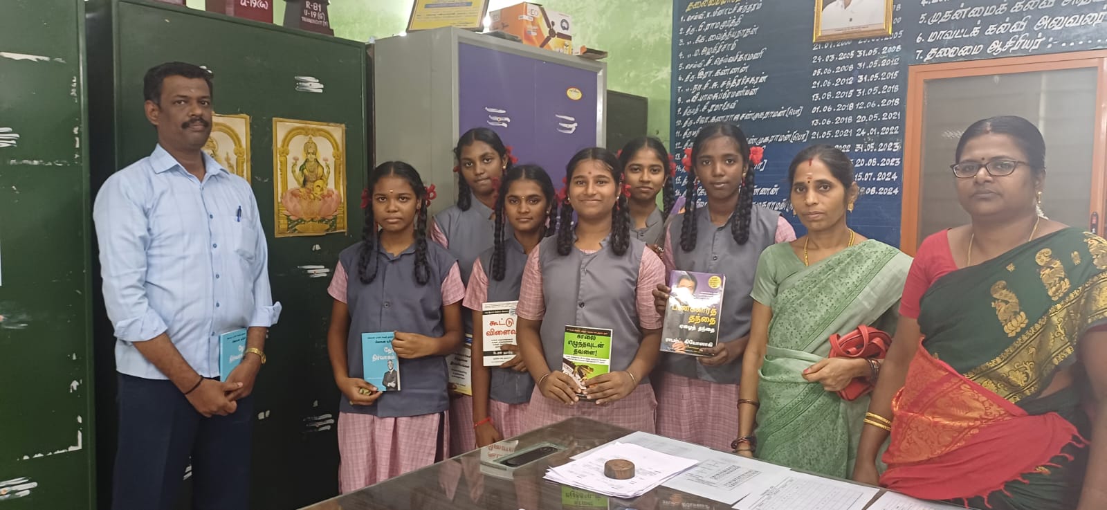Book distribution event with students and teachers